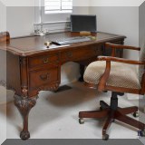 F12. The Ellis Line from Slight claw-and-ball foot desk with leather top. 31”h x 59”w x 29.5”d 